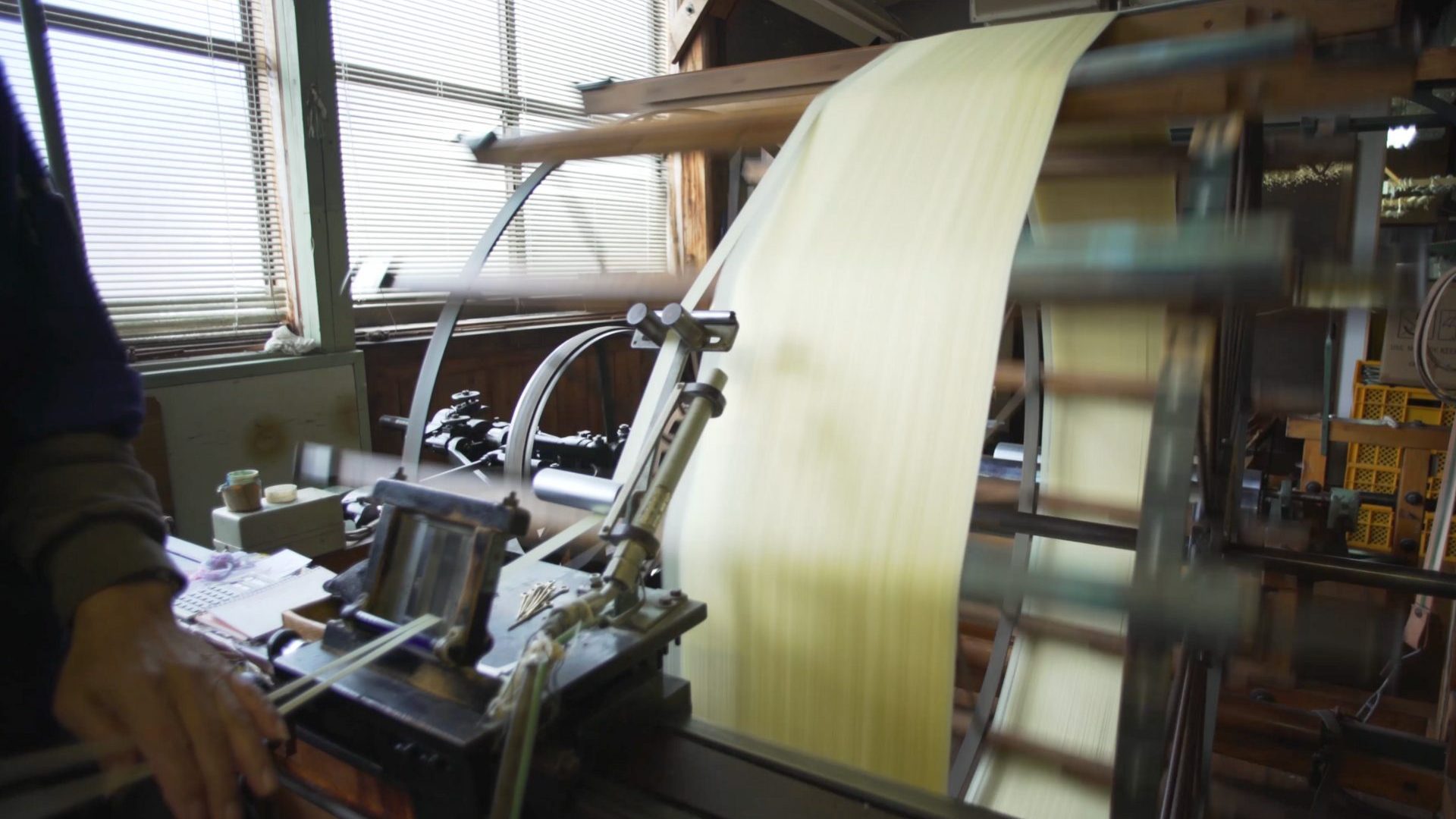 Traditional machine being used to weave silk.