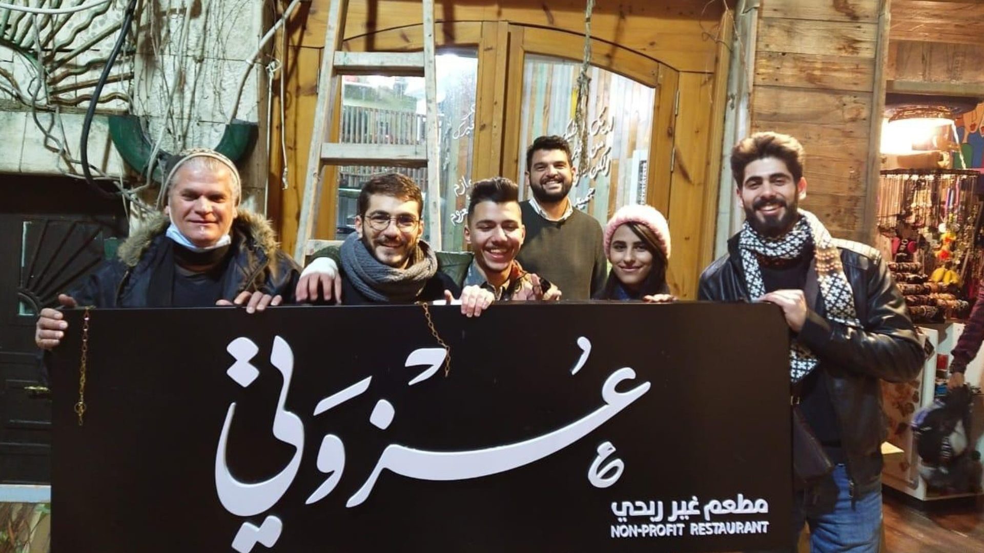 Group holds 'Ezwitti' sign