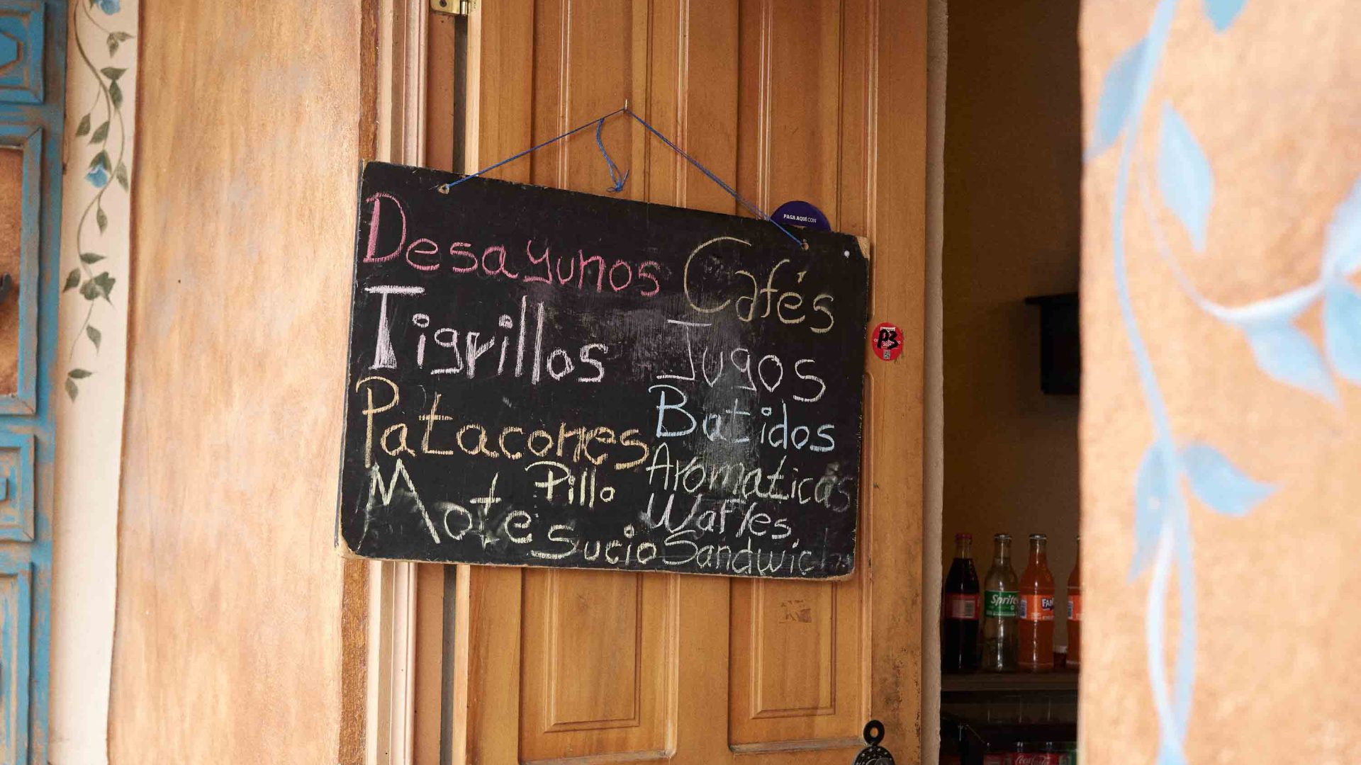 A blackboard highlights the meals and drinks available at a restaurant.