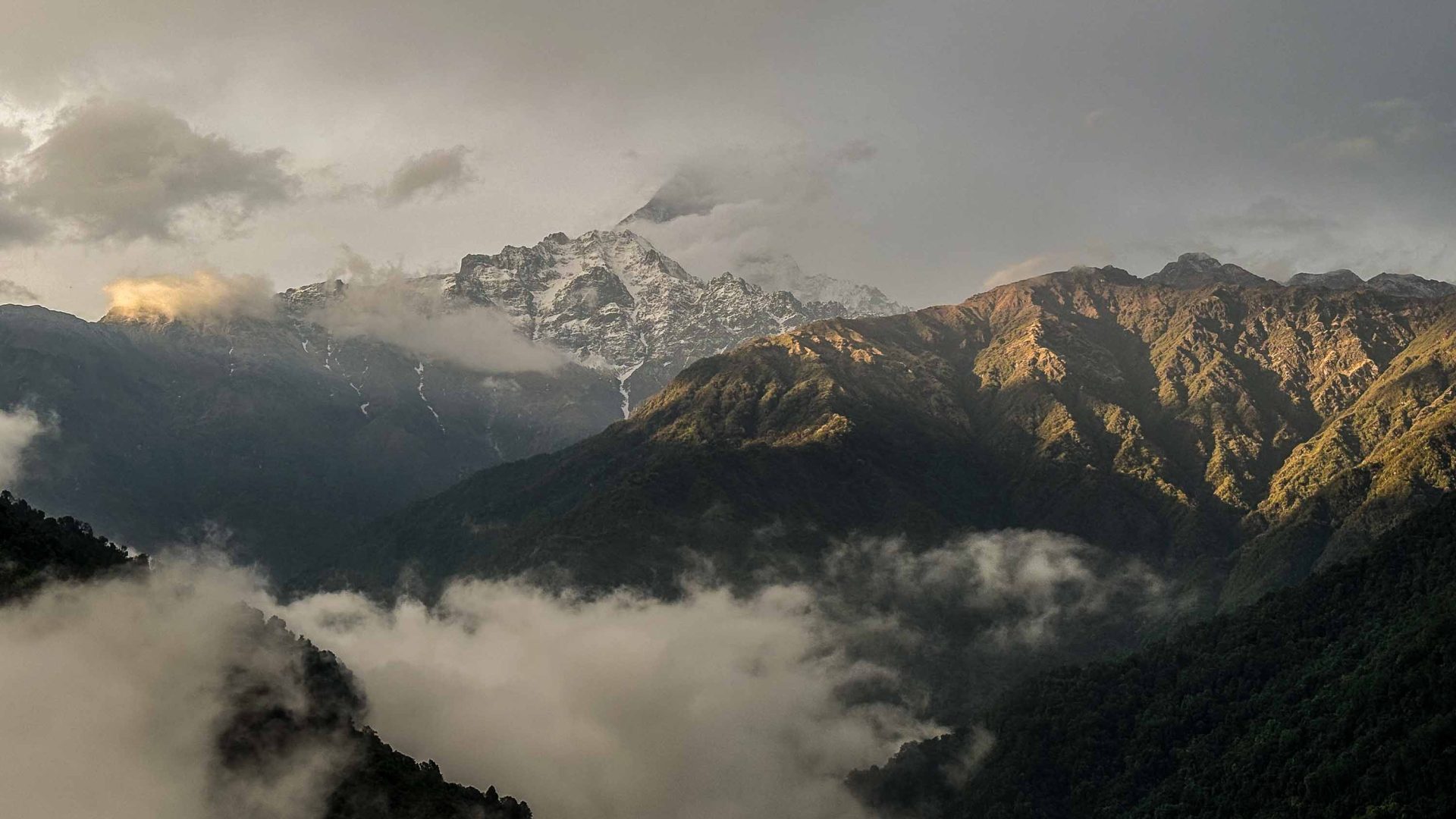 Clouds in front of mountains.