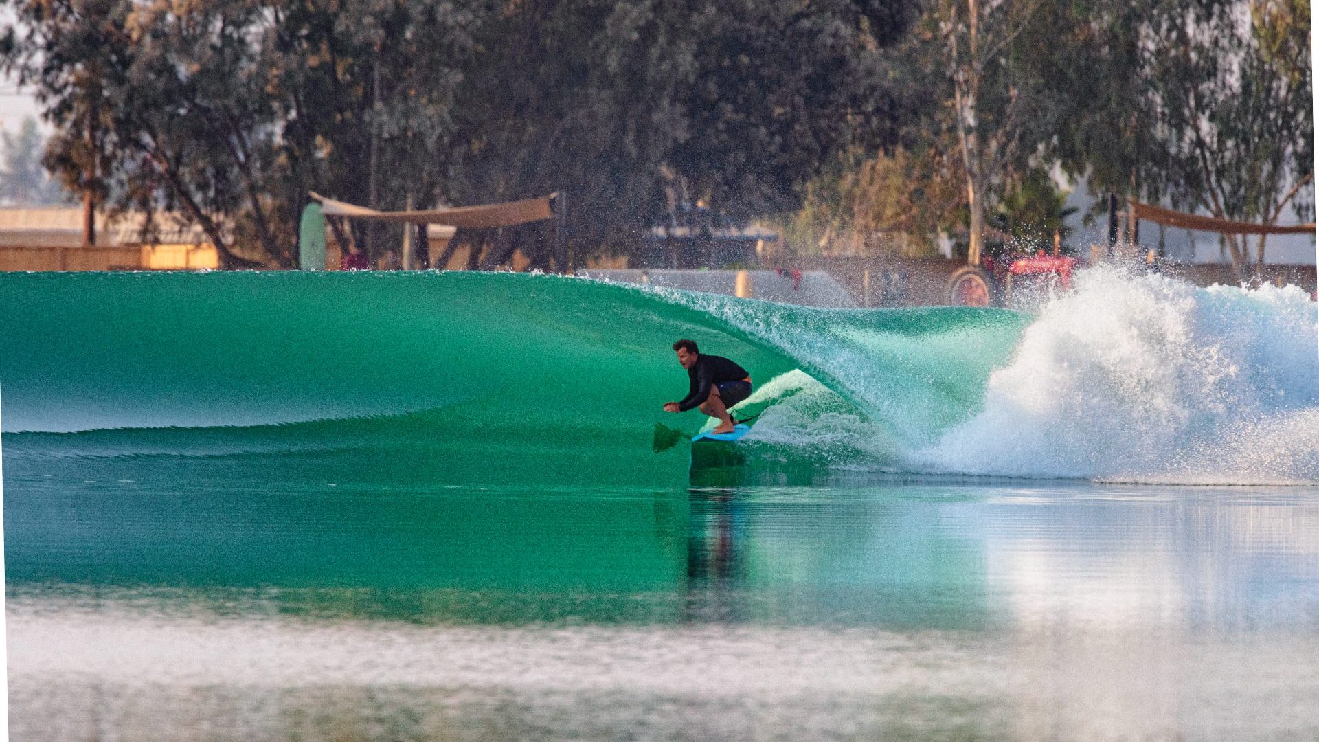 Man surfs green wave