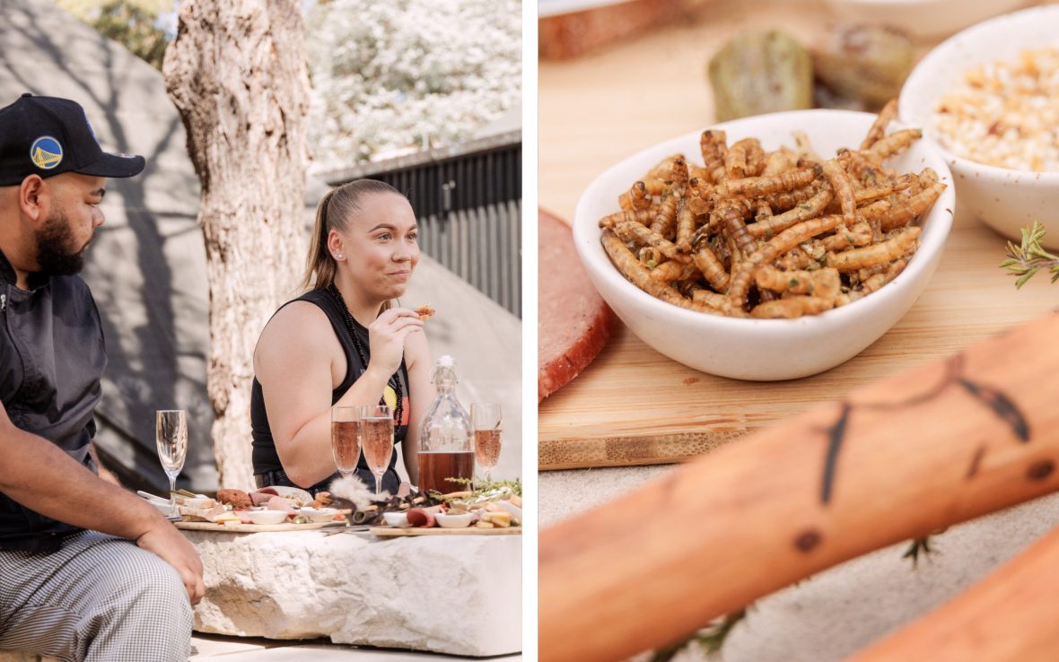 Left: A man in a cap and beard and a woman with a dark-haired ponytail sit at an outdoor table with a platter and glasses of wine.