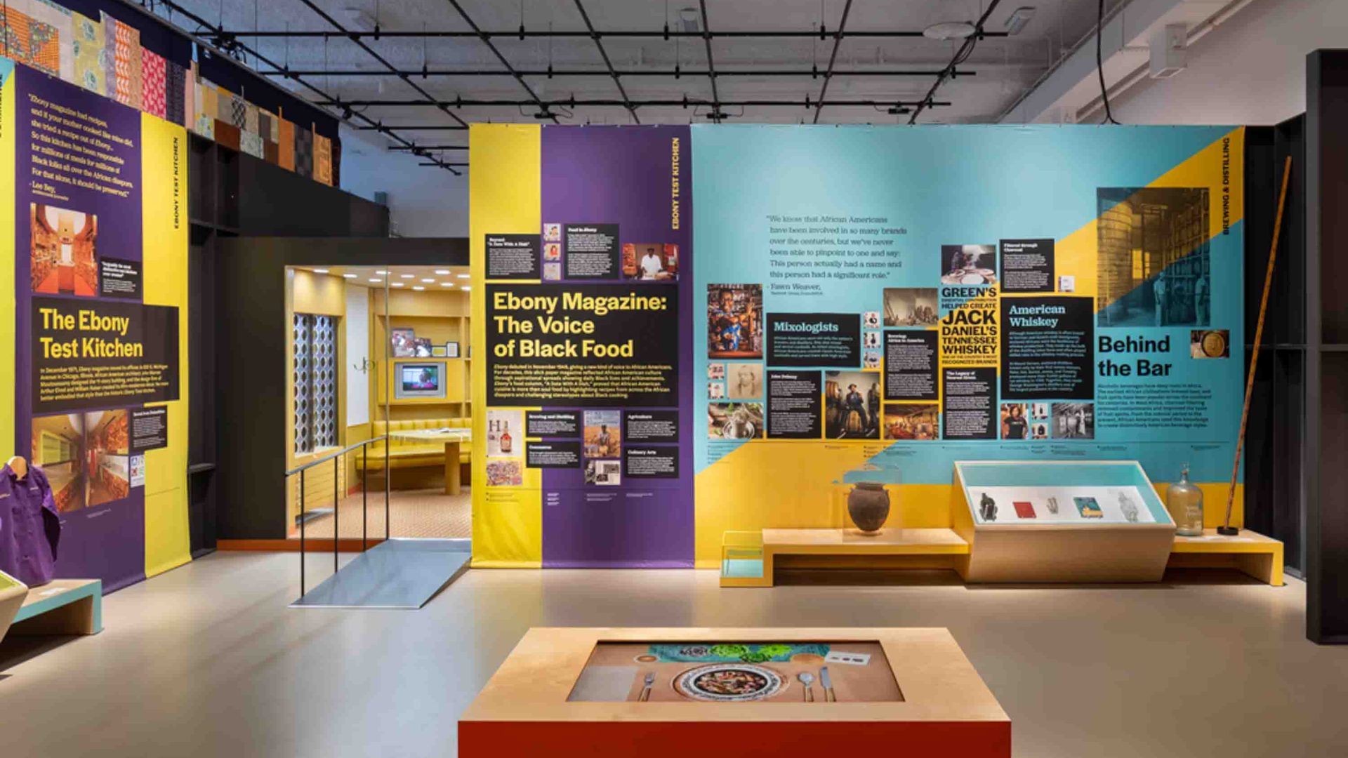 The yellow and turquoise interior of a museum.